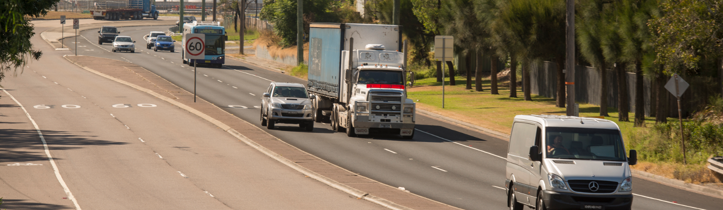 cars, trucks and buses on a highway