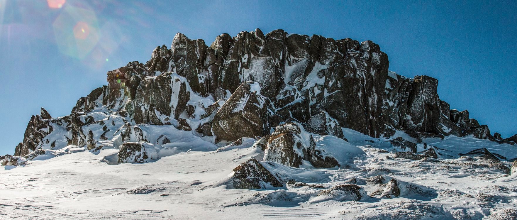 Granite boulders appearing out from the snow covered ground, Snowy Mountains