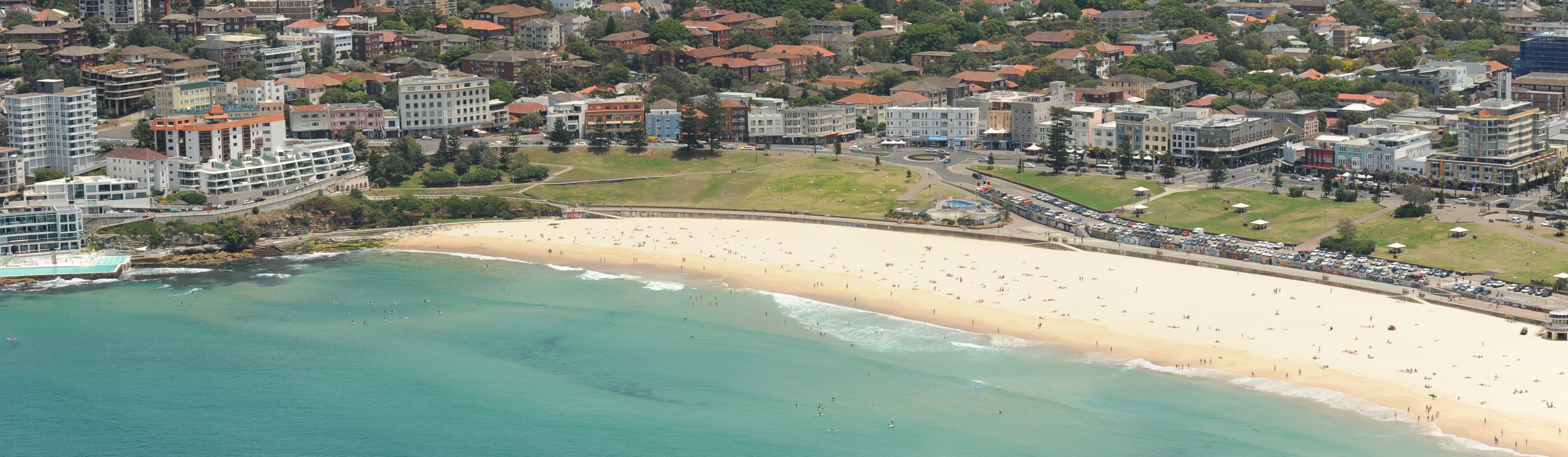 Oblique aerial photograph showing Sydney's Bondi Beach, residential and high-rise development