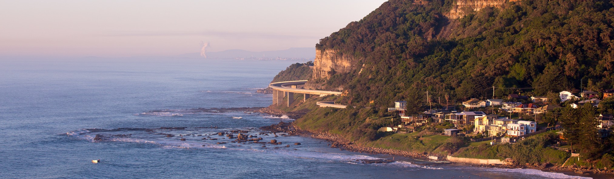 Cropped scenic photo towards Wollongong, with Seacliff Bridge and suburb of Coalcliff