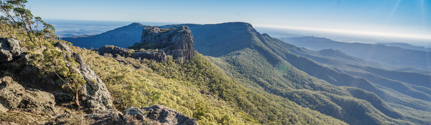 bush-covered mountains sweeping out to the horizon