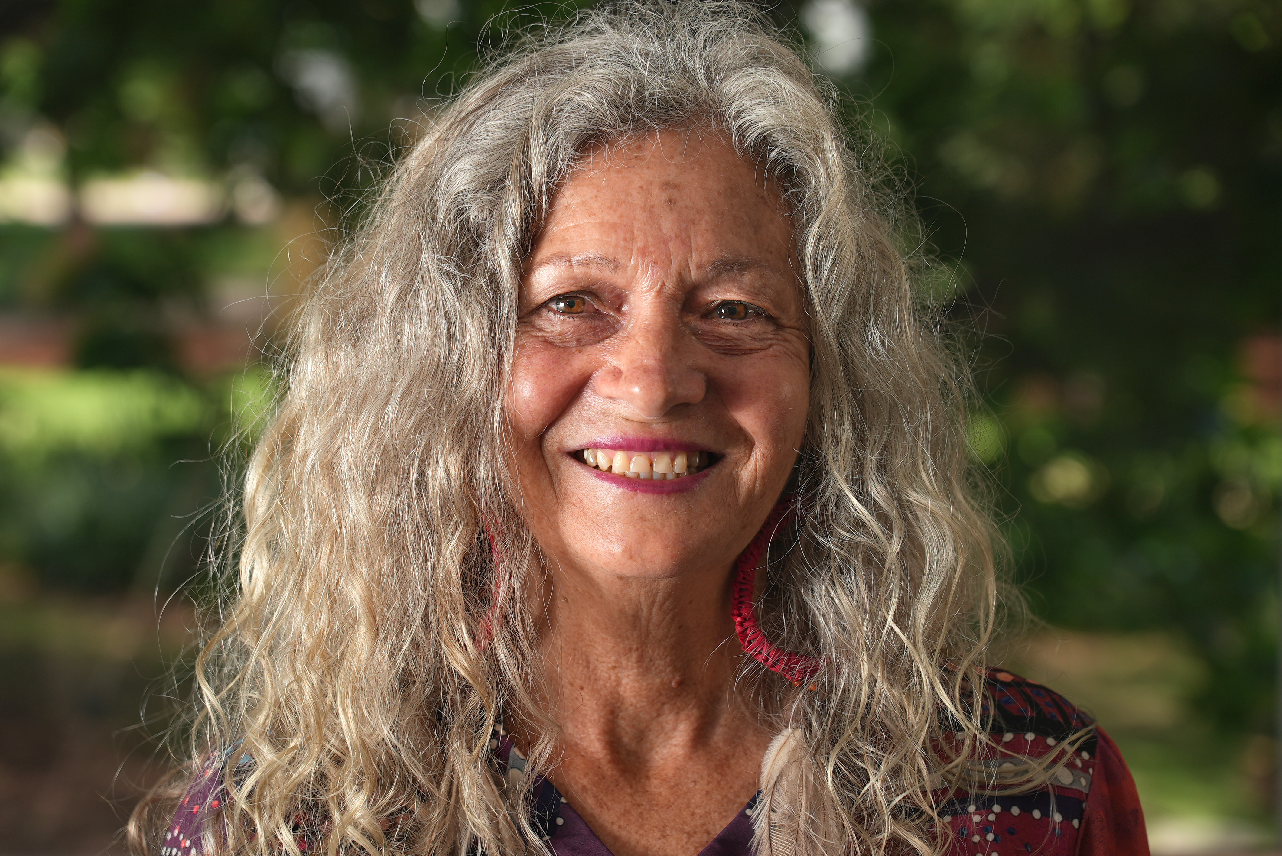 Smiling portrait photo of Aboriginal Peoples Knowledge Group chairperson, Aunty Rhonda